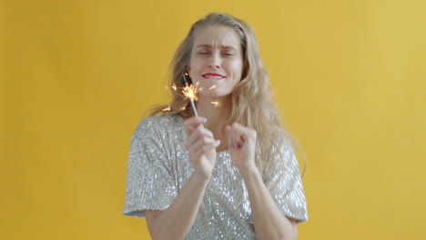 woman celebrating with sparkler