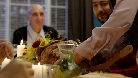 woman serving holiday turkey for family