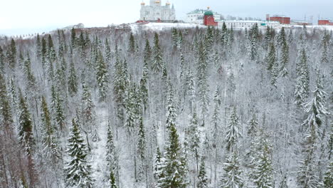 snowy forest and monastery landscape