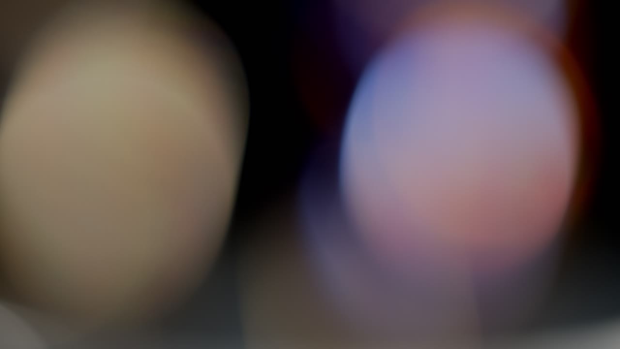 la luz multicolor filtra imágenes de 4k sobre fondo negro, vídeo estilizado, transiciones, efecto bokeh