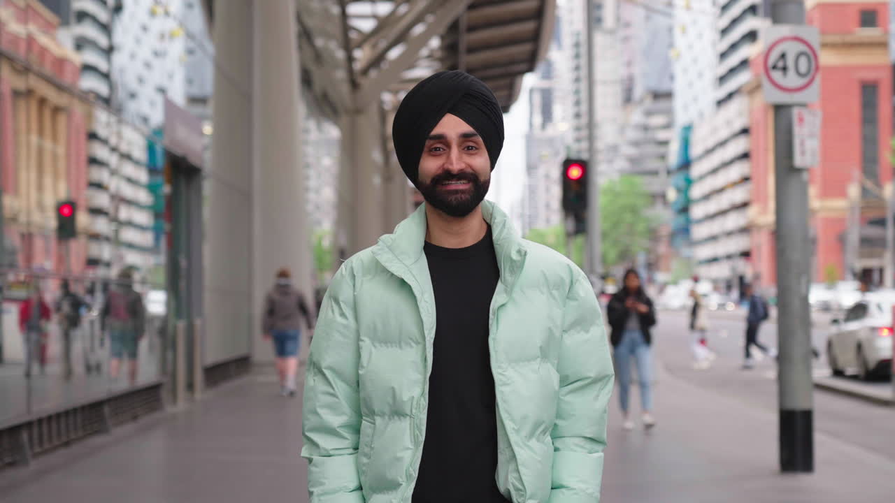 Handsome Punjabi Sikhi Man Wearing Traditional Turban Smiling In Camera At The City