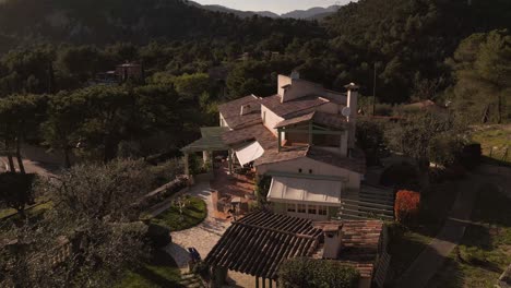 a luxurious house nestled in the lush countryside of the french riviera, aerial view