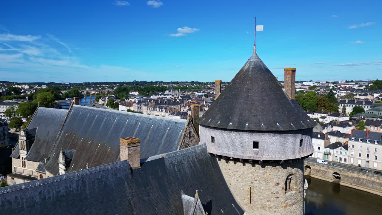 Laval Castle bastion with Mayenne river and viaduct in background, Laval, France. Aerial drone flyback