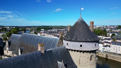laval castle bastion with mayenne river and viaduct in background, laval, france. aerial drone flyback