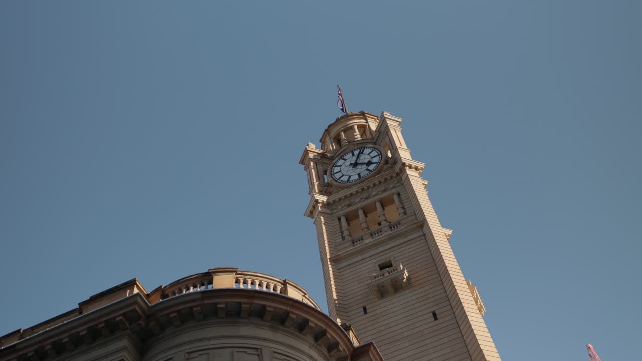 Close-up slow motion shot of the historic Central Station clock tower in Sydney