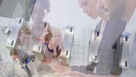 animation of diverse colleagues using laptops in office over commuters walking through turnstiles