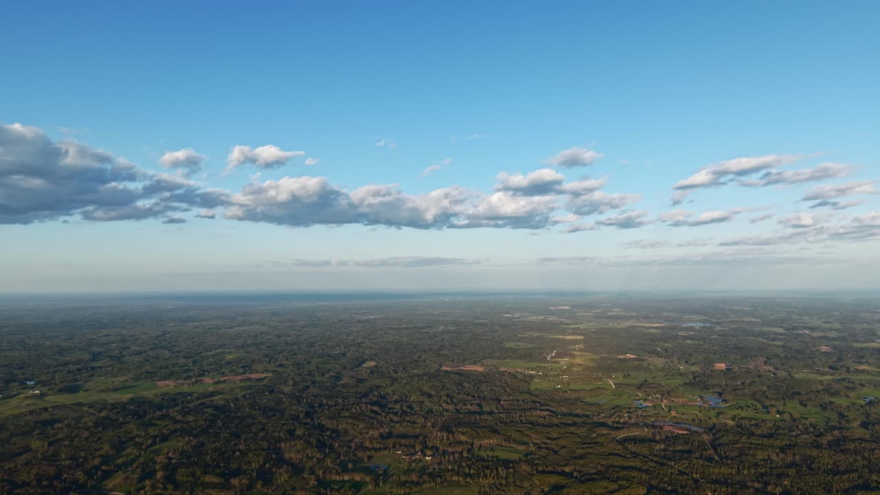 Remote natural terrain captured in high altitude aerial shot with visible horizon line