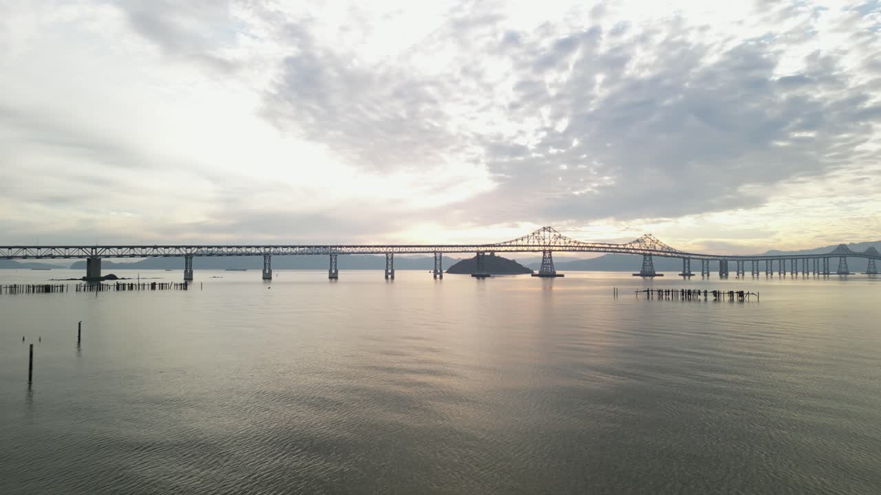 Stunning backlit silhouette of Richmond Bridge from Point Molate Beach Richmond California USA