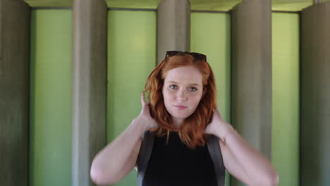 portrait of pretty woman smiling cheerful redhead student