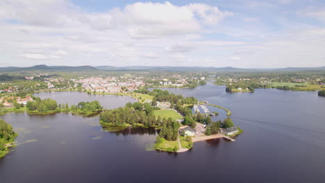 Aerial-view-over-Bollnäs,-Sweden-from-the-water