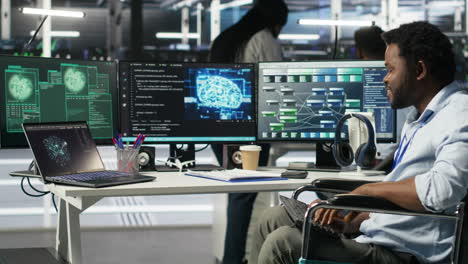 Data center engineer in wheelchair and coworkers fighting security breach