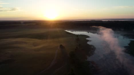 a country lake in the rays of the setting sun.