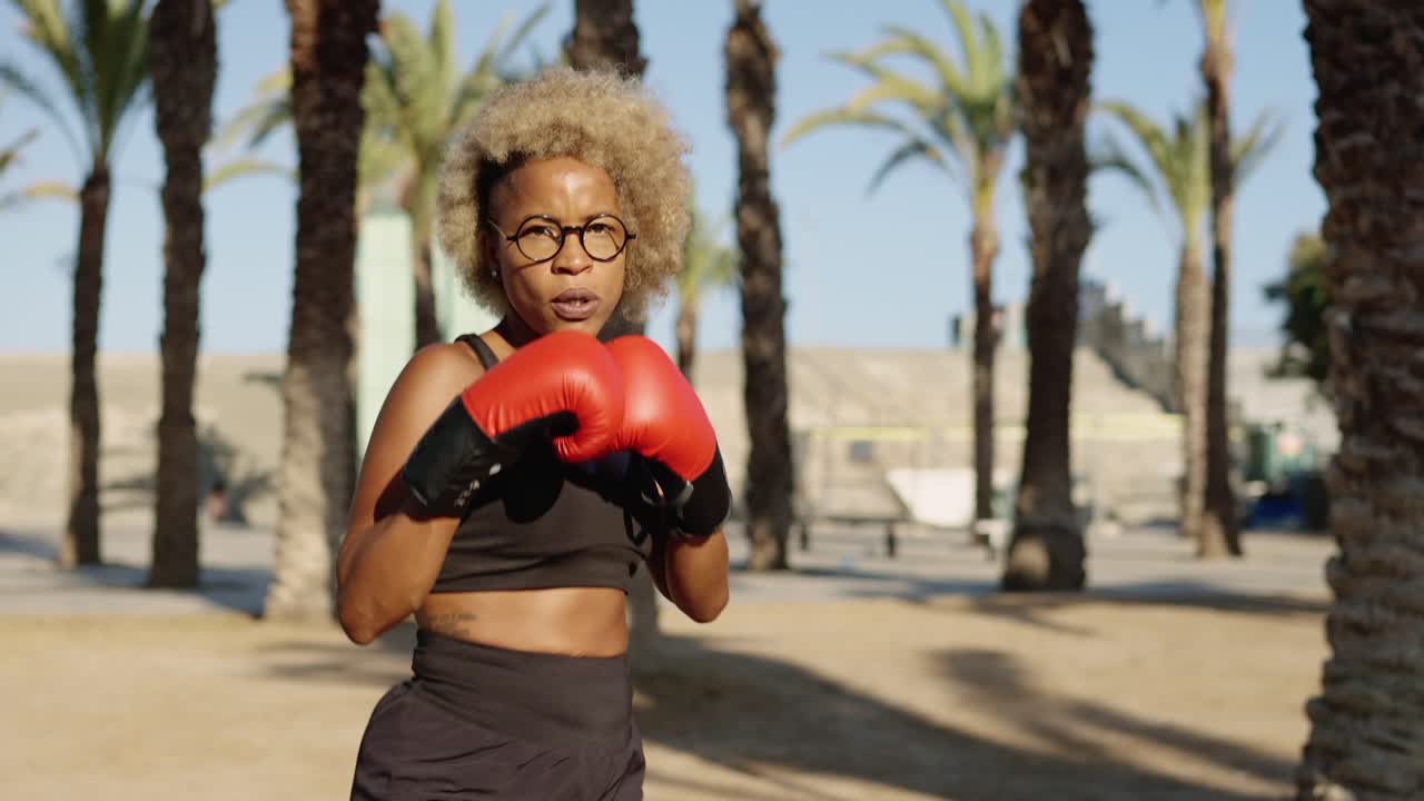 Woman boxing outdoors