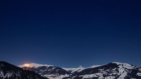 time lapse of a crystal clear starry sky over snowy ski resort