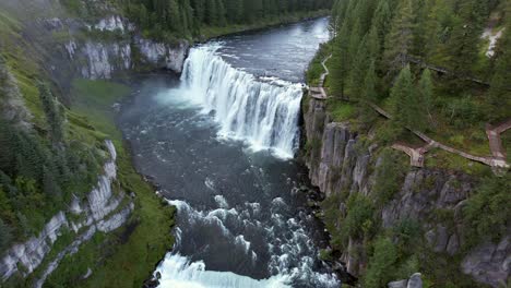 Drone-Aerial-of-the-Upper-Mesa-Falls,-a-thunderous-curtain-of-water-–-as-tall-as-a-10-story-building-Near-Island-Park,-and-Ashton,-Idaho