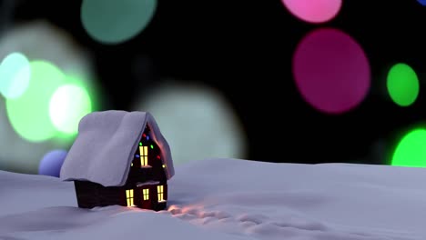 casa cubierta de nieve en el paisaje de invierno contra manchas coloridas de luz que caen sobre un fondo negro