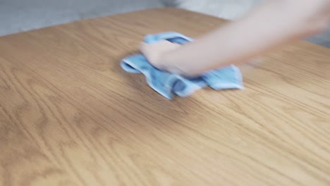cleaning table with a wet cloth