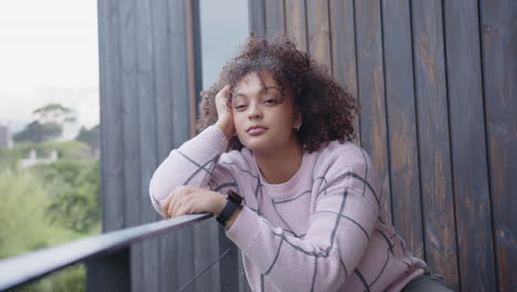 resting on balcony, plus size woman in casual wear looking thoughtful