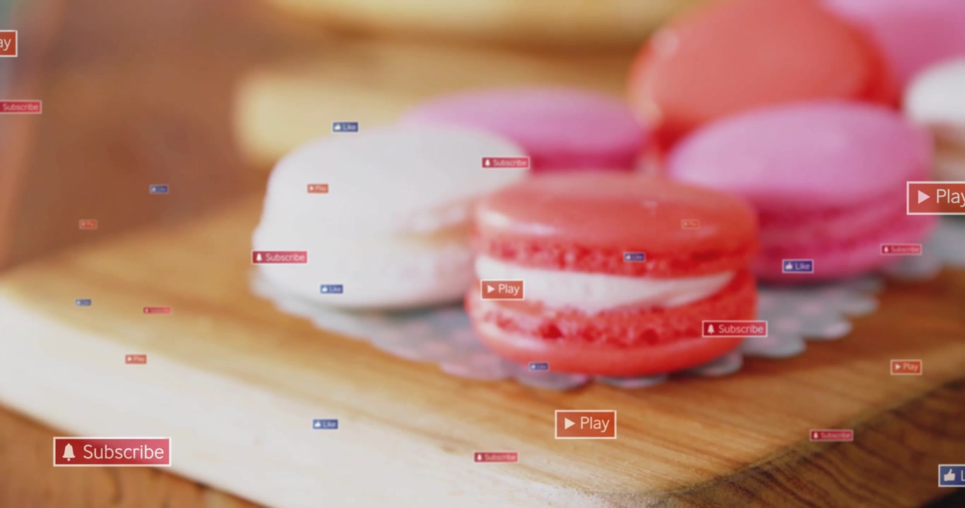Il primo fotogramma rivela un macaron rosso-rosa, con sovrapposizioni dell'interfaccia utente che fluttuano dai bordi, promuovendo le iscrizioni al canale.