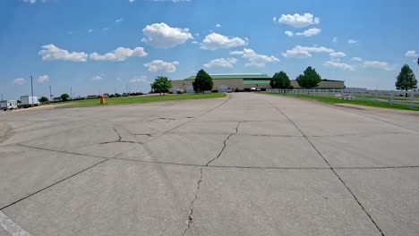 pov - driving towards cabela's headquarters and turning into the tractor-trailer parking area; concepts of highway transportation, hunting and fishing outfitter, retail