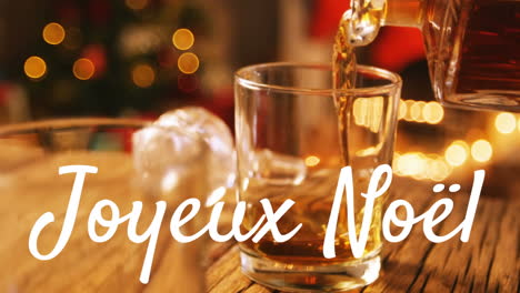 joyeux noã«l written over drink being poured