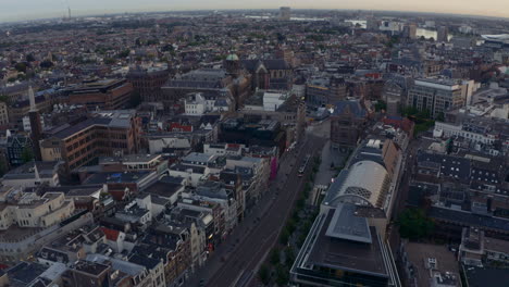 Drone-shot-over-Amsterdam-Tram-near-Dam-square