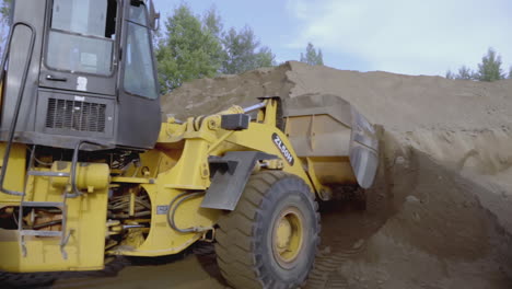 wheel loader loading sand