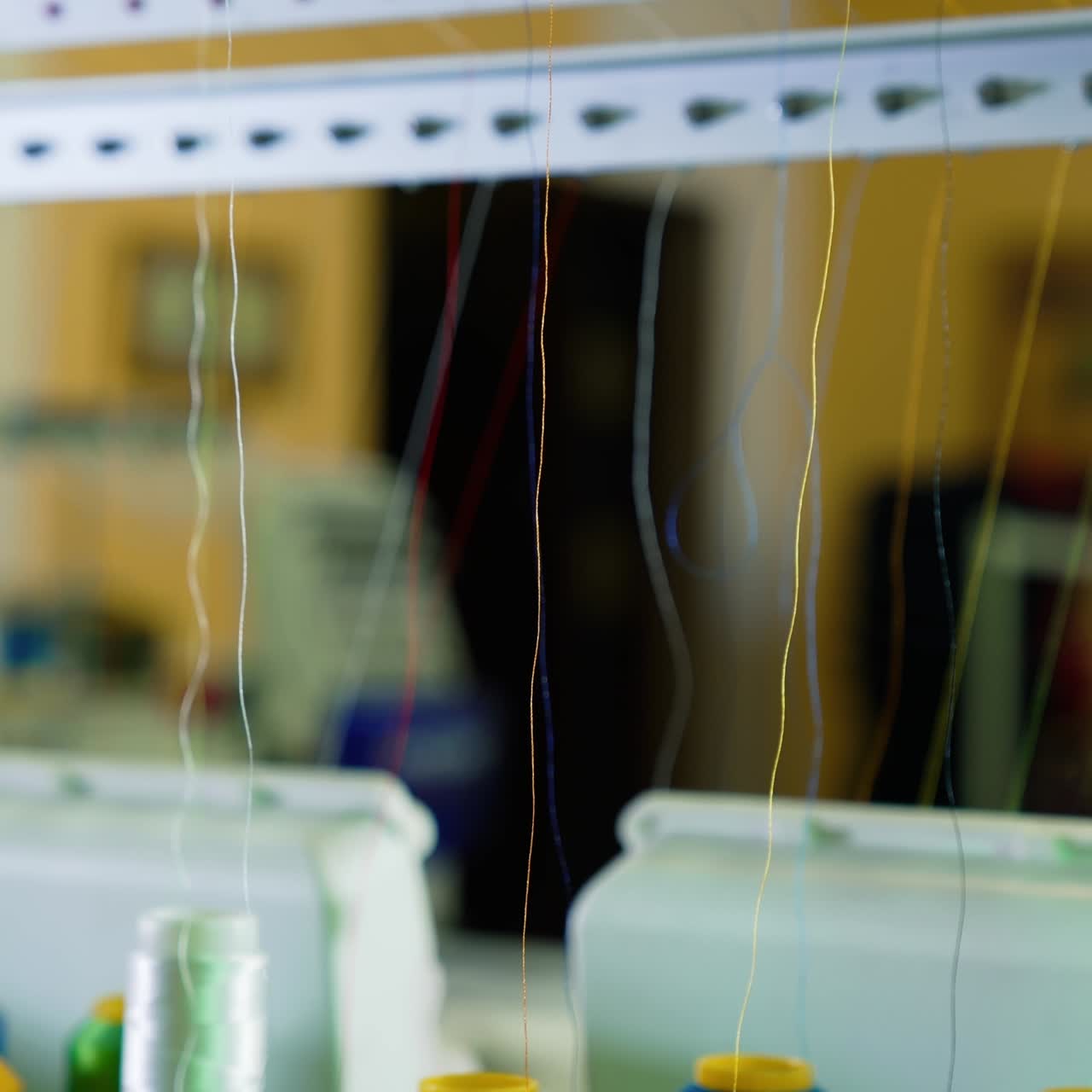 Different parts of sewing machine. Tailoring loom with rotating sewing reels