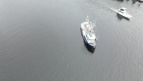 fishing style boat leaving port