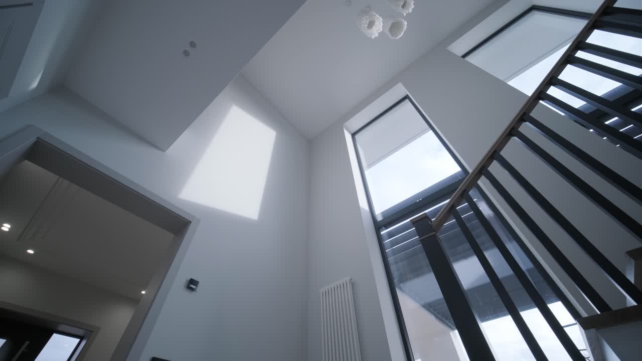 Interior design stylish wooden stairs inside the house with modern wooden railings and walls decorated with trendy lamps. Modern stairway or staircase inside in modern house interior