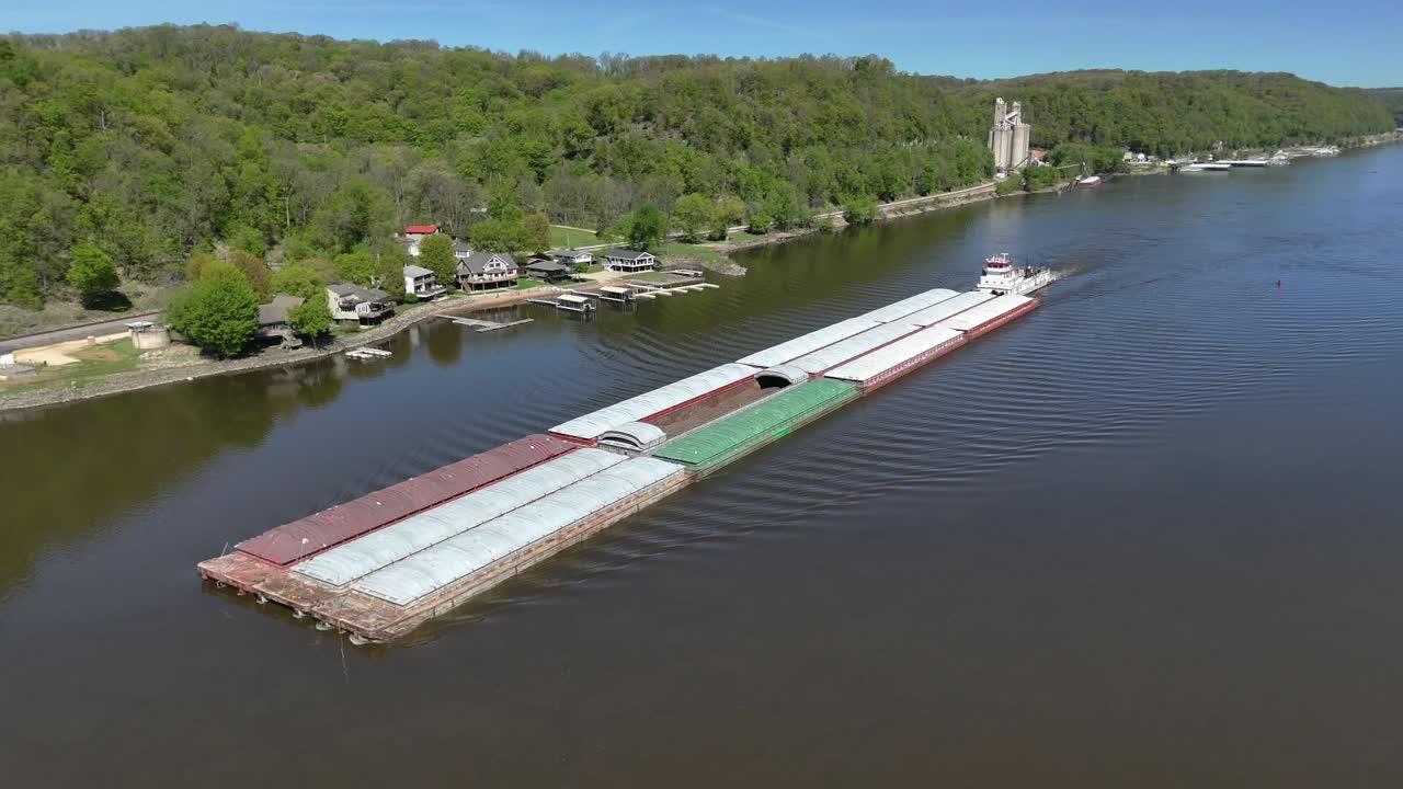 Located along the Mississippi River between Minnesota and Wisconsin's Driftless area, a towboat move a set of barges south.