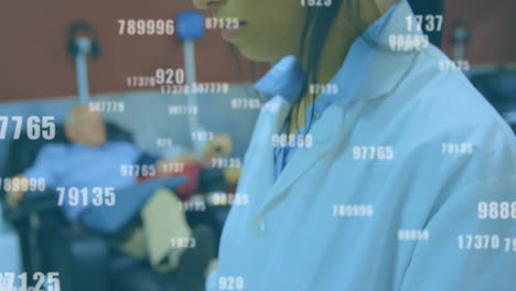 medical professional analyzing numerical data with animation overlay in office
