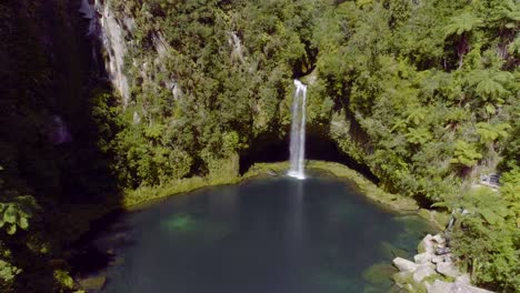 omanawa falls water falling down into canyon, scenic hidden waterfall new zealand