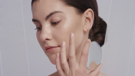 close-up-portrait-beautiful-young-caucasian-woman-holding-magnifying-glass-showing-smooth-healthy-skin-care-sensual-female-with-soft-perfect-complexion