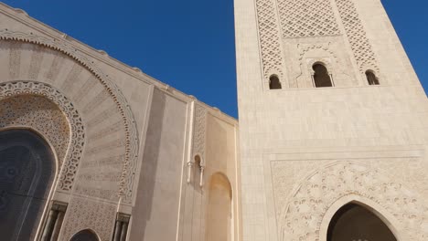 Hassan-II-Mosque's-entrance-gate-to-towering-minaret,-Casablanca,-Morocco