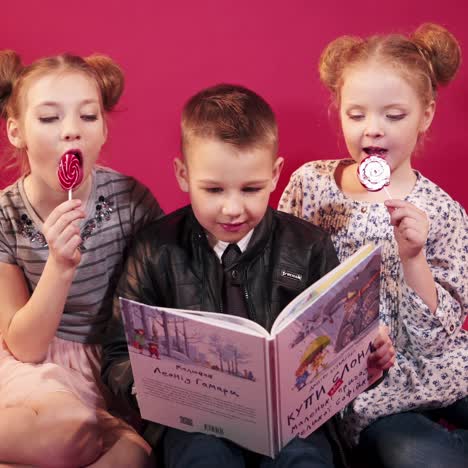 happy kids reading books together after school