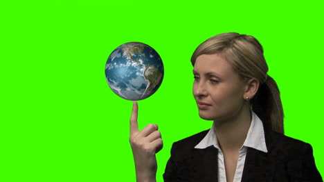 businesswoman with the earth rotating in her hands