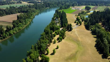 aerial view of a river running through farmland