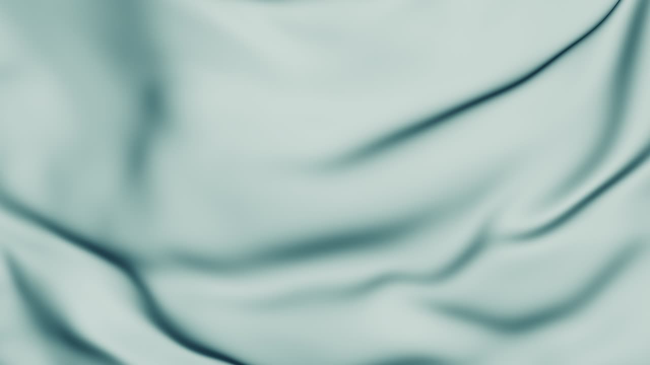 una hermosa tela turquesa vuela hacia abajo y abre una pantalla verde.