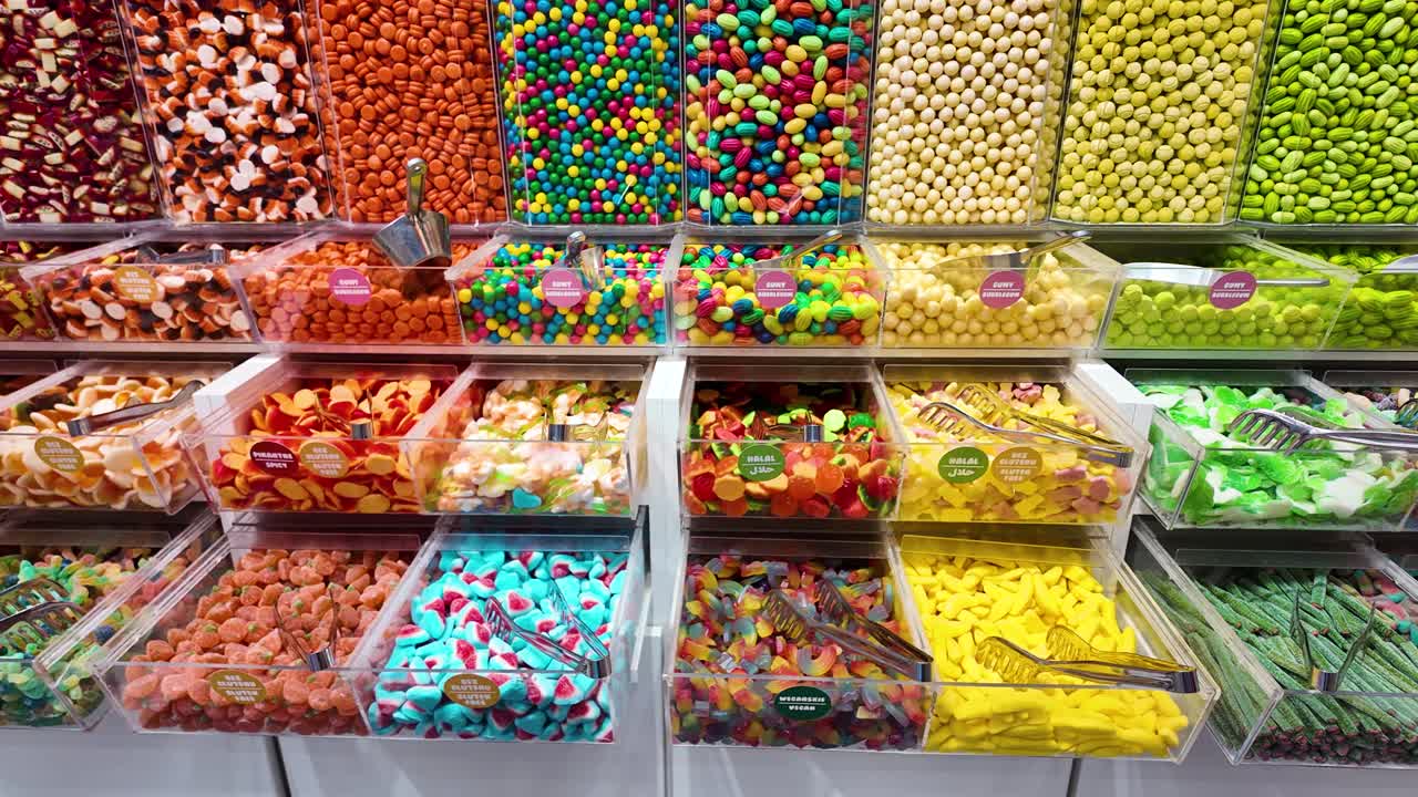 Close-up of colorful candy assortment in a shop, vibrant sweets with various shapes and sizes, inviting and playful