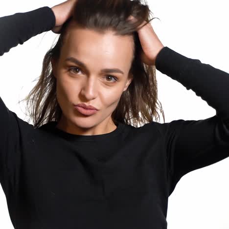 isolated woman playing with hair