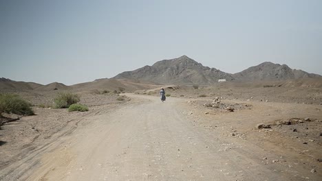 walking in the israeli desert with egypt in the background