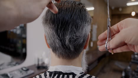 man getting a haircut at the barbershop