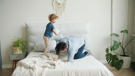 father and son pillow fight