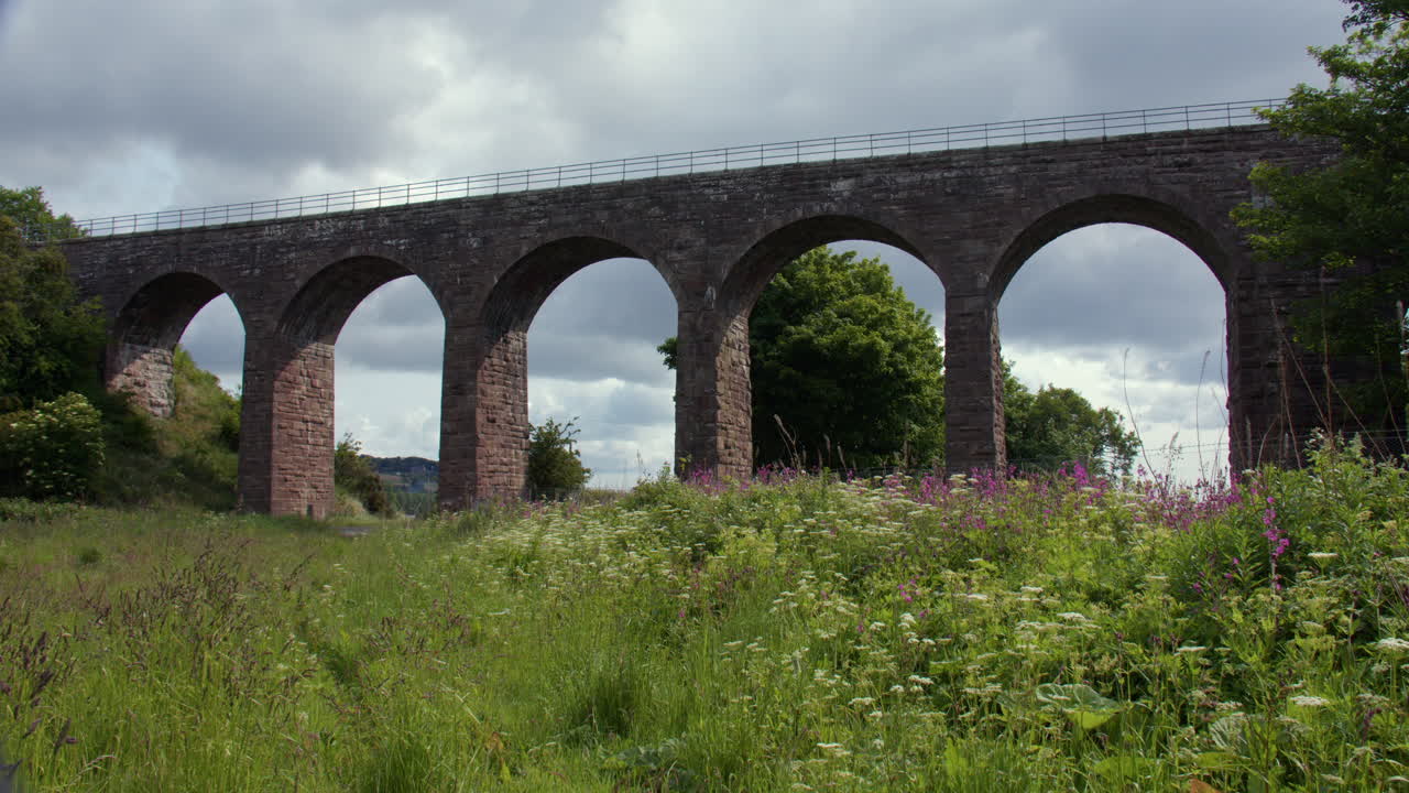Wide panning shot of The North Water Viaduct, disused railway viaduct on the north river esk. next to the A92