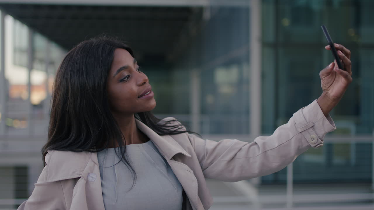 portrait of corporate business woman taking selfie beautiful african american student