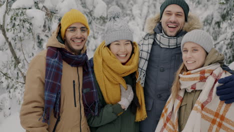 friends enjoying a snowy day in the forest