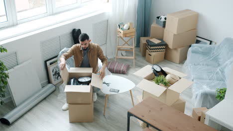 man packing boxes during a move