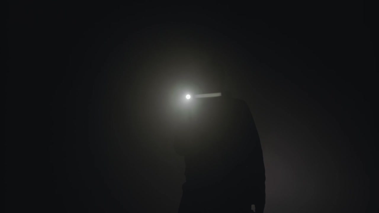 Person with Headlamp in Fog