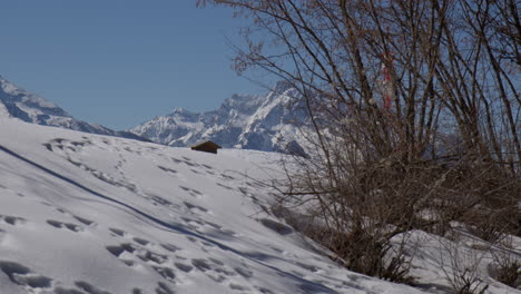 Snow Covered Hill On Winter Season With Bavarian Alps At Background On Daytime In Germany. Panning Shot